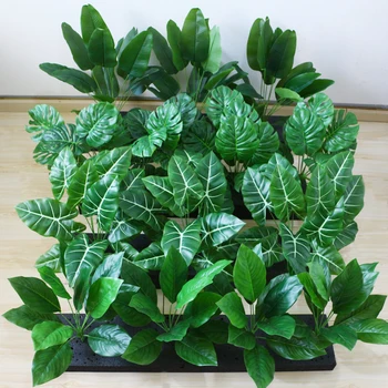 Изкуствено широколиственное растение монстера живовляк, тропически живовляк, зелен бонсай със зелени листа